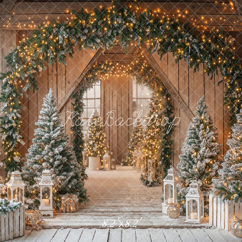 Kate Christmas Barn Garland Arch Snowy Pine Trees Lanterns Rustic Backdrop Designed by Emetselch