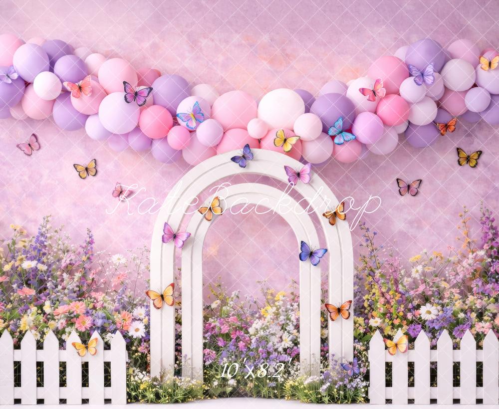 Kate Spring Flower Arch Pastel Balloons Butterflies White Fence Printed Backdrop Designed by Megan Leigh Photography