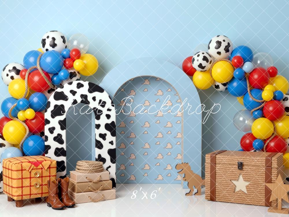 Kate Birthday Cowboy Cow Print Arch Balloons Toy Chest Blue Clouds Printed Backdrop Printed Backdrop Designed by Mini MakeBelieve