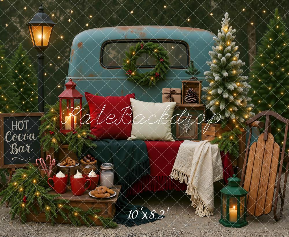 Kate Christmas Truck Hot Cocoa Bar Trees Lantern Sled Backdrop Designed by Mini MakeBelieve