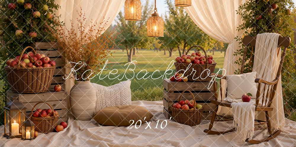 Kate Fall Picnic Apple Arch White Drapes Cozy Chair Baskets Crates Lanterns Printed Backdrop Designed by Ashley Ward