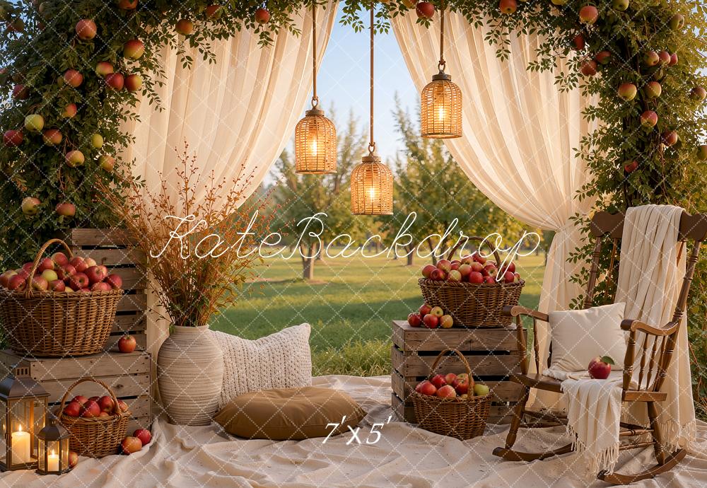 Kate Fall Picnic Apple Arch White Drapes Cozy Chair Baskets Crates Lanterns Printed Backdrop Designed by Ashley Ward
