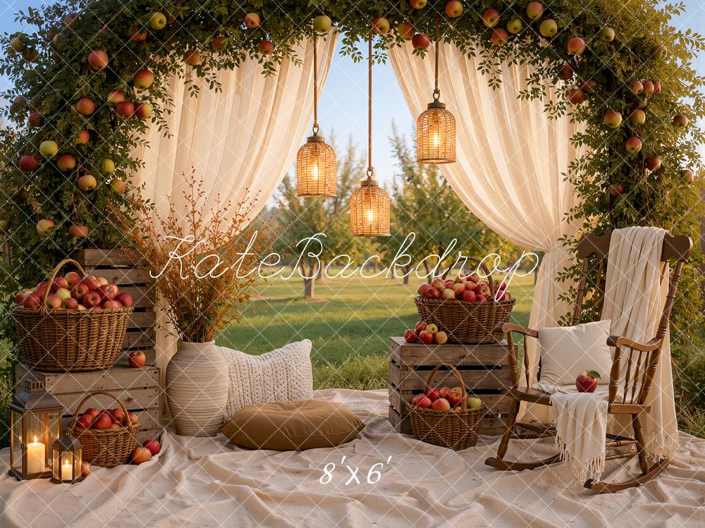 Kate Fall Picnic Apple Arch White Drapes Cozy Chair Baskets Crates Lanterns Printed Backdrop Designed by Ashley Ward