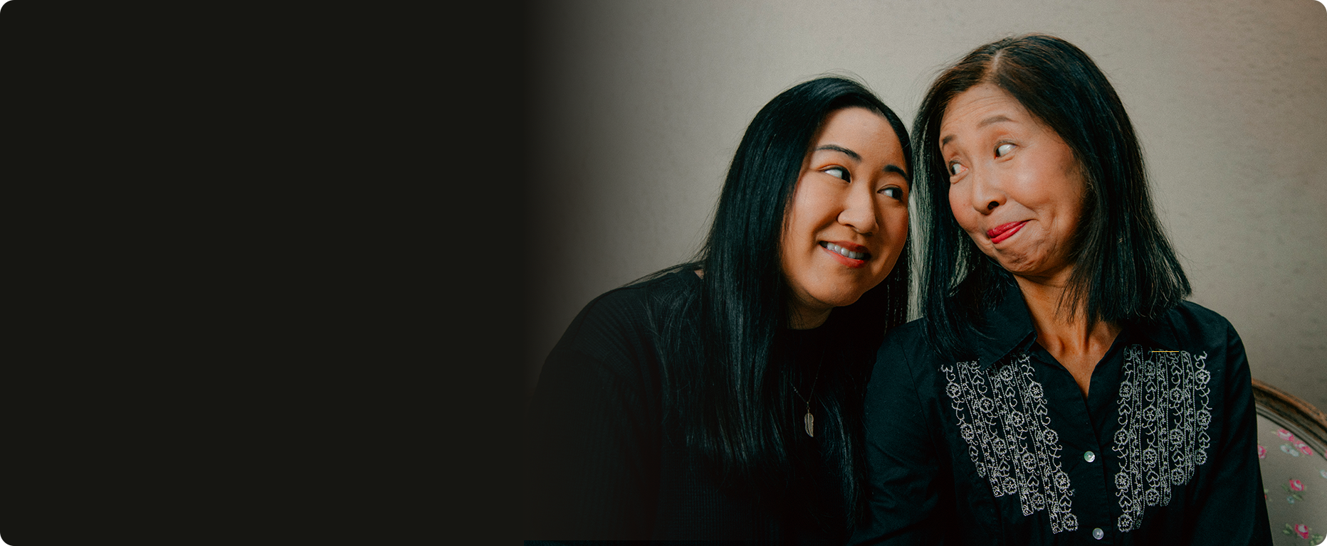 Two photographers sitting together in their studio