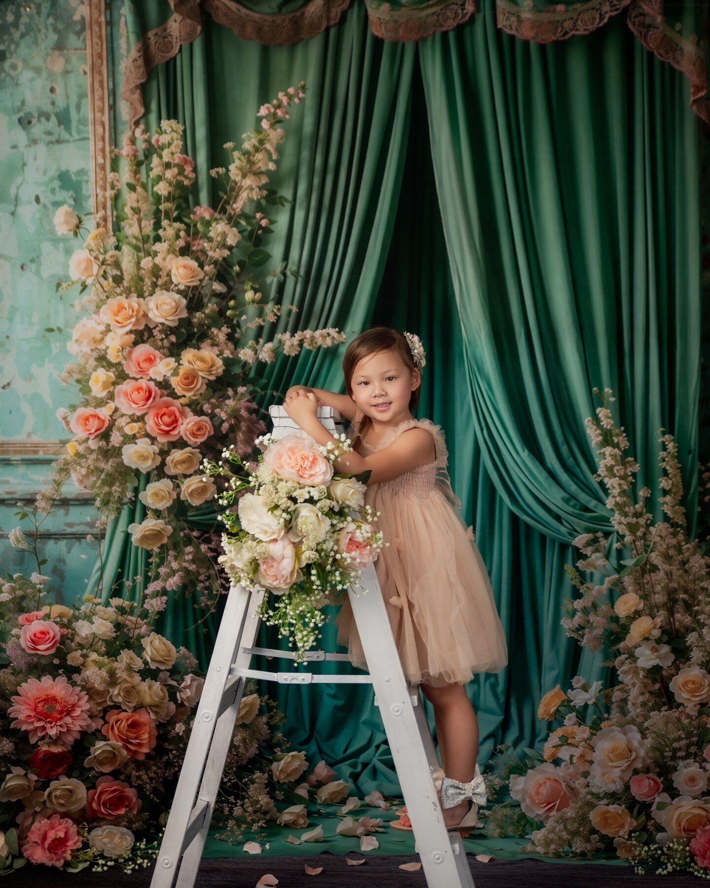 A child portrait in a floral studio scene