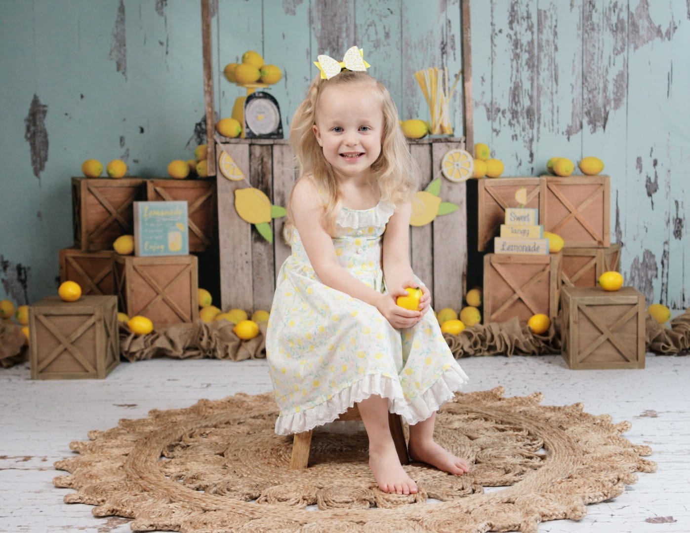 Kate Lemonade Stand with Blue Backdrop Designed by Mandy Ringe Photography